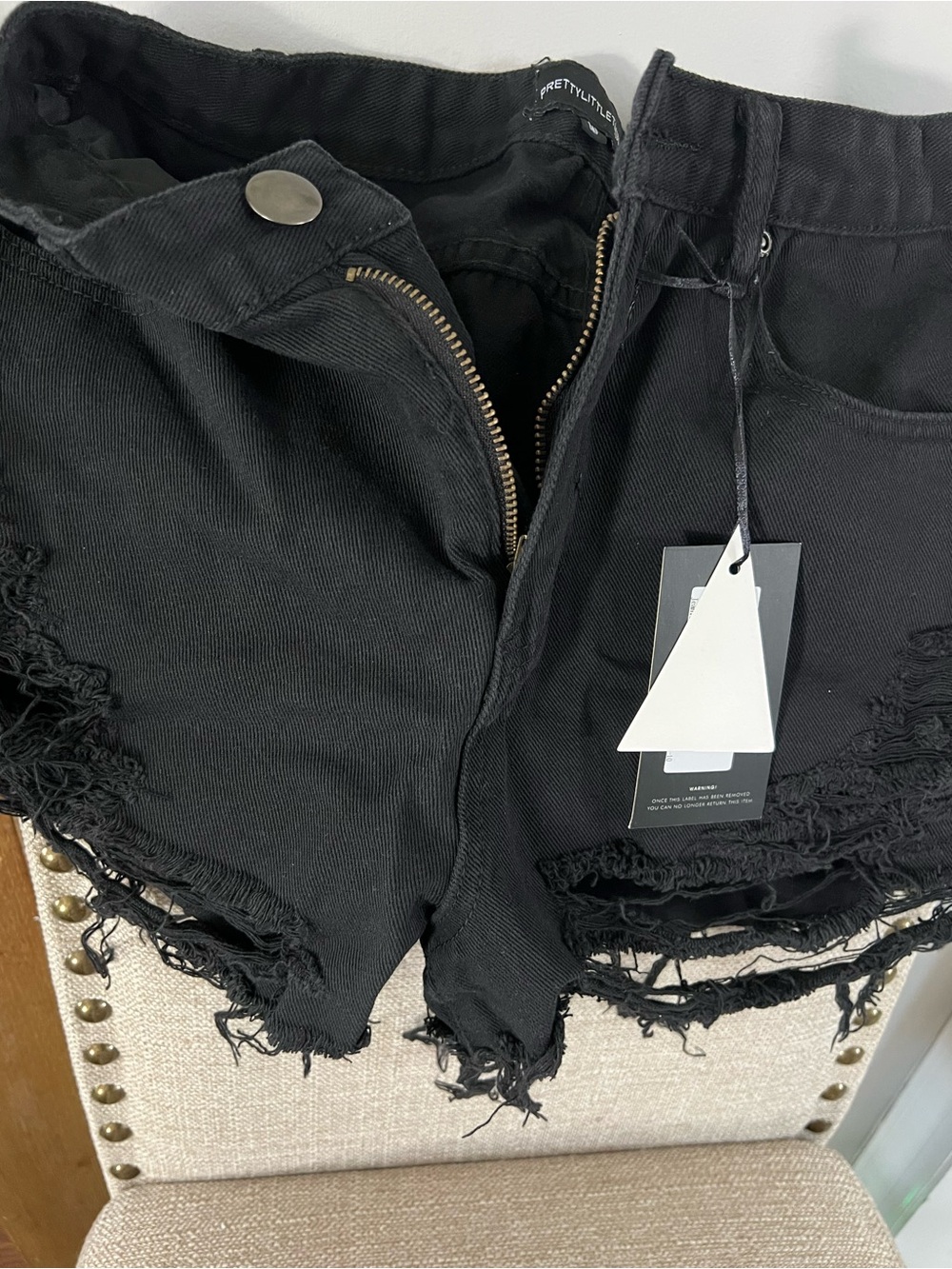PrettyLittleThing Black Distressed Denim Cutoff Shorts
